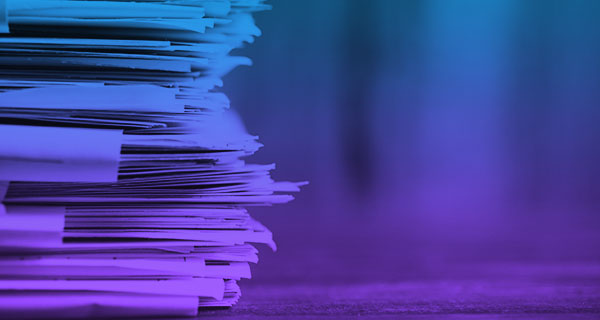 stack of papers zoomed in with navinet purple gradient overlay