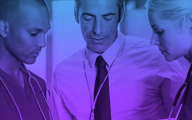 Nurses and Doctor looking at tablet with purple gradient overlay