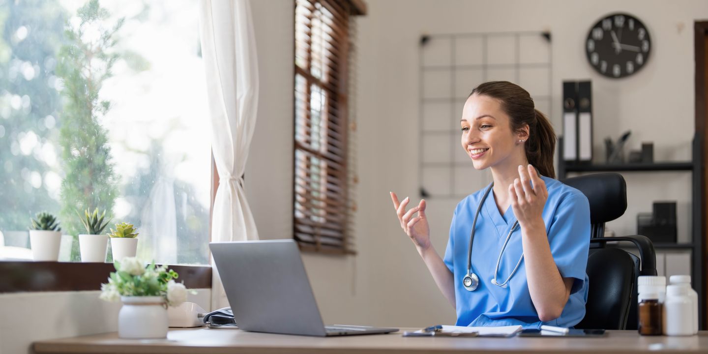 Nurse working on a laptop at her desk