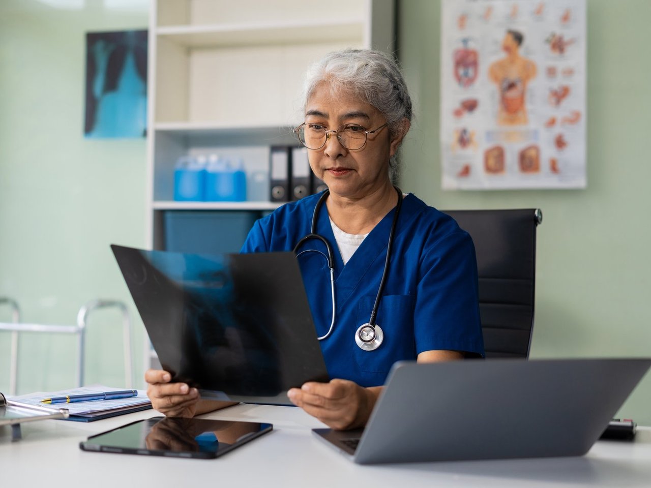 Oncologist reviewing evidence-based treatment plan