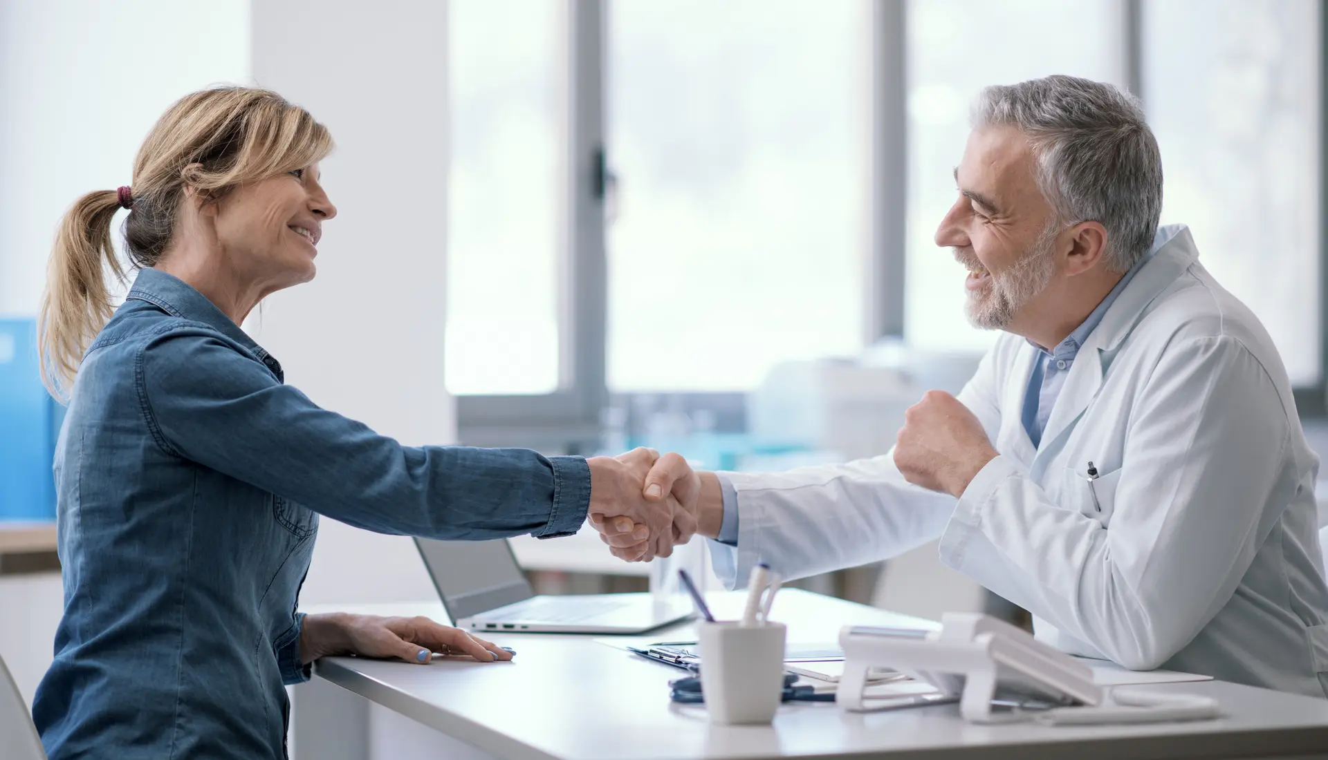 Doctor and patient sharing a positive moment, representing strong network relationships
